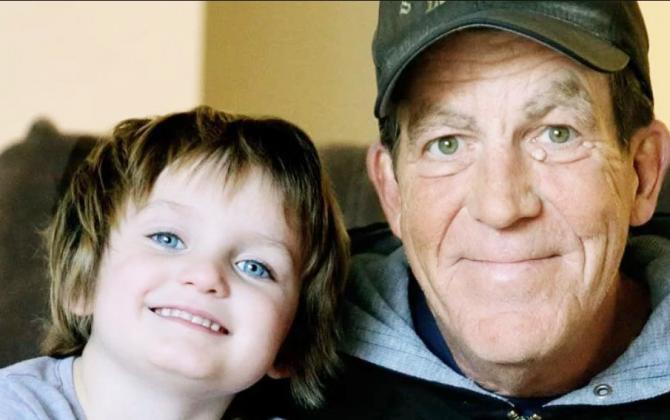 Jim Hickey is shown here with 5-year-old Paishence Hansen of Cozad. Hickey was in the midst of walking from Scottsbluff to Omaha raising money and awareness for Hansen’s fight with cancer, when he learned during a stop in Aurora that he had been diagnosed with cancer himself.