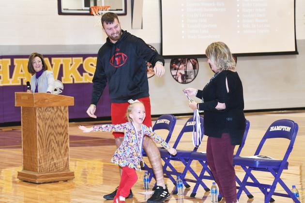 Young Sophia Clinch was soaring with excitement after receiving an academic achievement medal from Austin Allen during Monday’s Hawk Honors assembly.