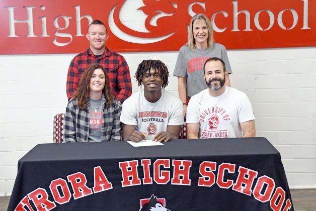Mack Owens signed his letter of intent to South Dakota Dec. 15 alongside his parents, Nick and Amy Owens, at right, as well as Matt and Nicole Broman. 