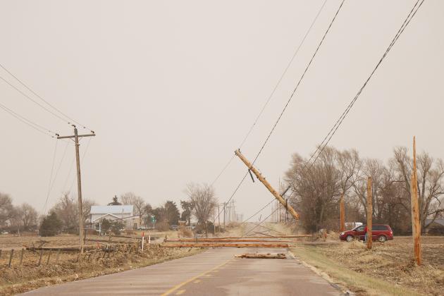 Several power poles were downed across the county in last week’s storm, including on 6 Road east of Giltner.
