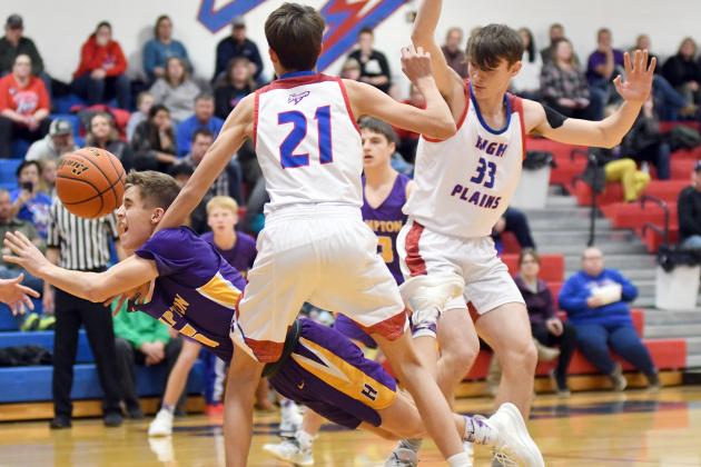 Drake Schafer loses control as the Hampton senior drives the lane during the Hawks’ 52-43 loss to High Plains Thursday. Schafer led his team with 17 points. 