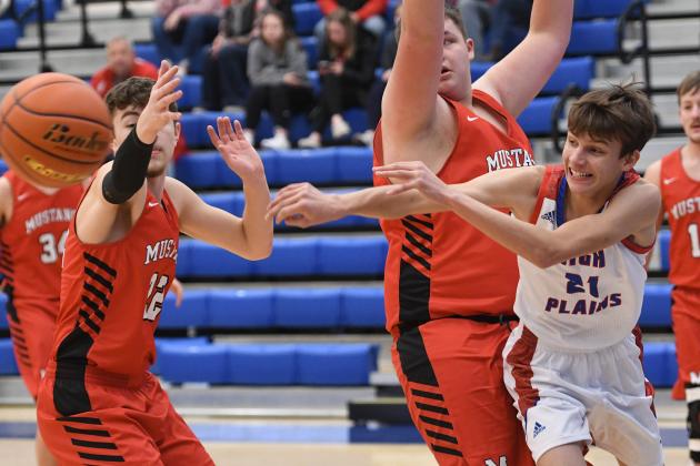 High Plains’ Tyler McNaught makes a pass in the lane during the Storm’s 48-37 opening round CRC Tournament victory over Meridian Saturday.