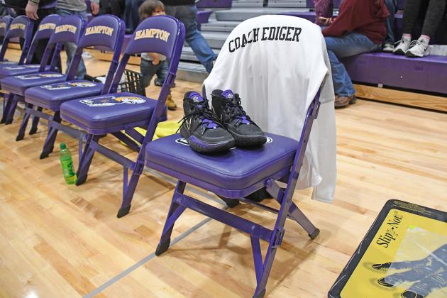 A single, empty seat at the head of Hampton’s bench was the focus of the night Friday as a gymnasium full of family and friends paid tribute to Coach Kyle Ediger, who was killed in a car/train accident earlier in the week.