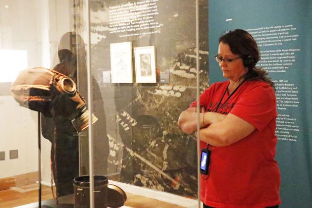 Aurora Middle School special education teacher Sally Hoos spent a quiet moment observing this gas mask while taking Friday’s tour of the Auschwitz Exhibition in Kansas City.