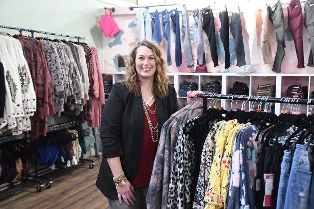 Kelsey Hofmann showcases women’s clothing available through her Urban Chic Boutique business, when she recently converted from a mostly online venture to a downtown local sharing space with Honeysuckle Lane.