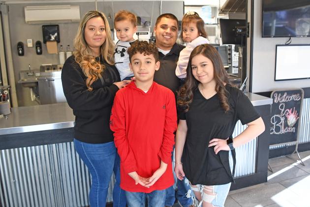 Ernesto Franco, pictured here with his wife Karen and children Victoria, Brayden, Aliana and Ayden, has announced plans to open Blazin’ Wings N More at 850 Q St., in Aurora.