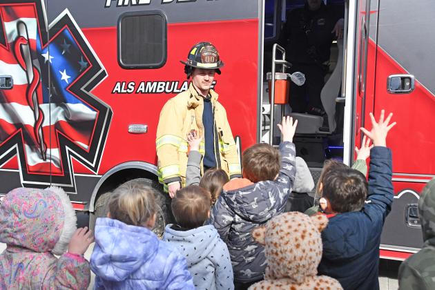 Aurora firefighter and EMT Dalton Chastain asked students who wanted to go first for a look.
