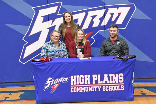 Hannah Hodgman signed on to join the Hastings College cheer team alongside her mother, Michelle Aase, HPC cheer coach Jayden Urkoski and Hastings College coach Jordan Smith. 