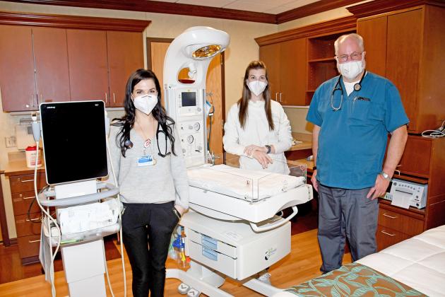 Pictured from left, OB doctors Jennifer Harney, Alexis Erbst and Jeff Muilenburg stand in a room previously used as a birthing suite. Much of the equipment remains after a transition to a shared care model, giving  OB physicians tools needed for prenatal and postnatal care for moms and babies.