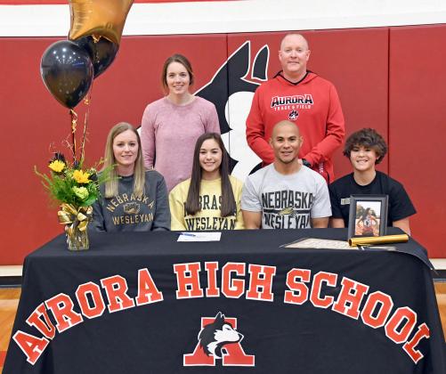 Kaylee Crosby signed her letter of intent to run track at Nebraska Wesleyan with her parents, Mike and Carrie as well as Aurora coaches Gordon Wilson and Kelly Boshart and younger brother, Kayden. 