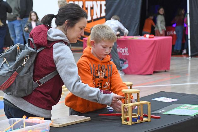 Laura Reeson and her son, Quinn, experiment with one of many exhibit’s at Thursday’s STEM Night hosted by Giltner Public Schools.