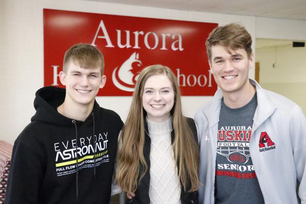 Aurora High School seniors Caden Carlson (left), Elena Kuehner and Preston Ramaekers have recently been named National Merit Scholar Finalists. They await the final round of selection later this year.