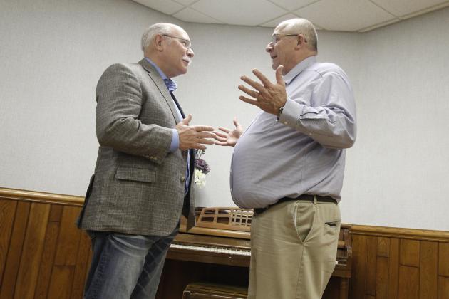 Dist. 34 Sen. Curt Friesen converses with Aurora City Administrator Rick Melcher after his town hall speech at the Bremer Community Center Friday. Friesen is nearing the end of his final session, since he is being term-limited out at the end of the year.