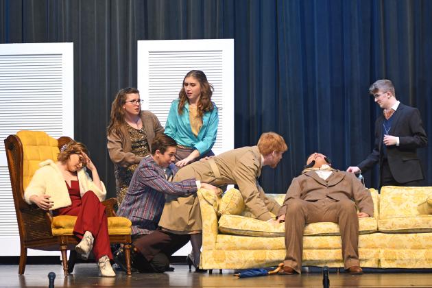 Successfully completing their weekend pair of shows, the cast of “Madam’s Been Murdered, Tea Will Be Late,” at Aurora High School gave the murder mystery their best. Pictured here, Katie Balfour (left, Kimberly Friesen) watches as Matilda Trent (Jorja Pohlmeier), Mark Jacobs (Lucas Talkington), Trisha Jacobs (Sarah Springer) and Inspector Milo (Andrew Reed) discover the dead body of Major Armbrewster (Martin Holke). Robert Totter (Daniel Helzer) watches the scene unfold from the background.