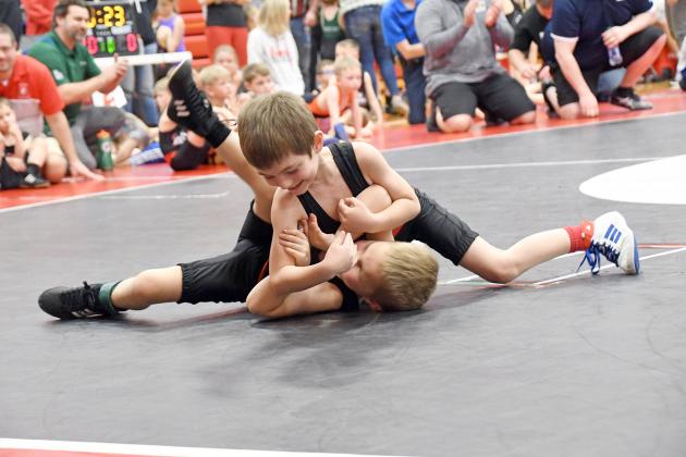 Young hopeful Briggs Timm goes full throttle for the pinfall victory over his Aurora teammate, Harrison Dubas. 
