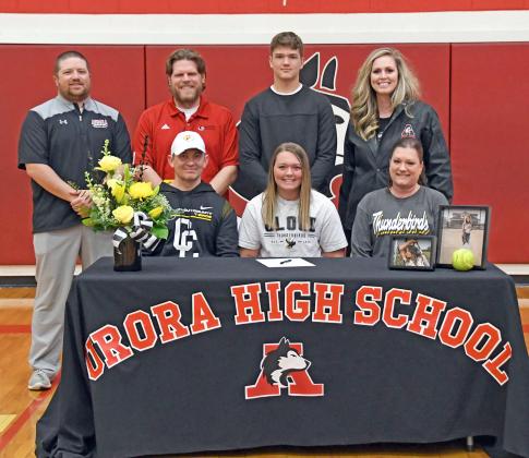 Taryn McKinney was joined at her Thursday softball signing to Cloud County CC alongside her parents, Brett and Sheri, brother Owen and Aurora softball coaches Bodie Moeller, Joe Vanderpool and Ashton Voss. 