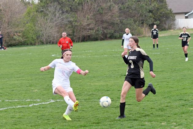 Aurora’s Taylor Janda tries to clear the ball during first half action of a 6-2 loss to GINW in the B-7 subdistrict tournament.