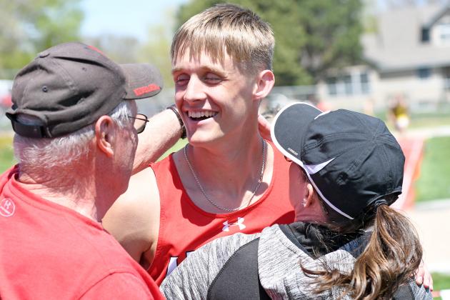 Carsen Staehr celebrates with his family after breaking his own school record in the triple jump at the B-5 district track meet in Broken Bow.