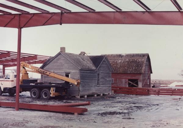 This snapshot back in time shows the barn and house being moved into the shell of the Wesley Huenefeld Agricultural Museum. It’s dated somewhere between 1985-86.