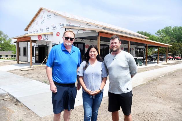 Pictured from left in front of the new Aurora Community Clubhouse are Dan Ziegler, clubhouse manager; Taylor Willis, Poco Creek Golf Course board president; and Dan Kaminski, golf course superintendent. The clubhouse is currently under construction and is expected to be ready for use in July.