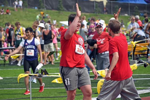 A dynamic duo, Aaron Jividen (left) gives his fellow athlete Sammie Weddle a high-five. 