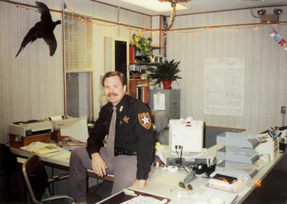 Brad Moeller at his desk at the Harlan County Sheriff’s Office. Moeller joined on Halloween of 1989 and would stay for two years until moving to Hamilton County. 
