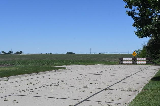 With B Street in the foreground and Highway 34 in the background, this photo shows a parcel of land on the west edge of Hampton that is planned for future housing/commercial development.
