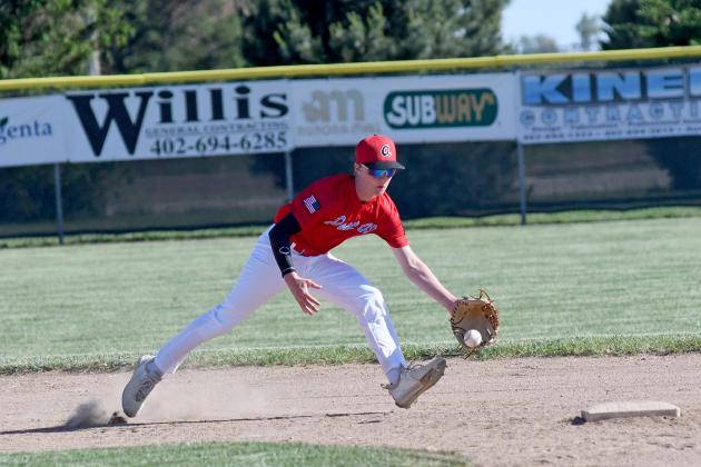 Aurora Coop shortstop Jack Spiehs stops a grounder up the middle during a reserve game at Mitchell Field last week. 