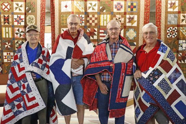 A group of local veterans were honored with their very own Quilt of Valor by the Nimble Thimble Quilt Guild in a ceremony over A’ROR’N Days weekend. They were, from left: Cecil Walter Jacobs, Larry Bengston, Robert Oswald and Clifford “Butch” VanWormer.
