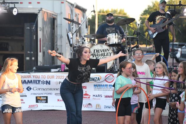 Devon Worley got up close and personal with kids in the audience during Friday’s Bands on the Bricks debut, inviting  the crowd to dance and sing along to the music.