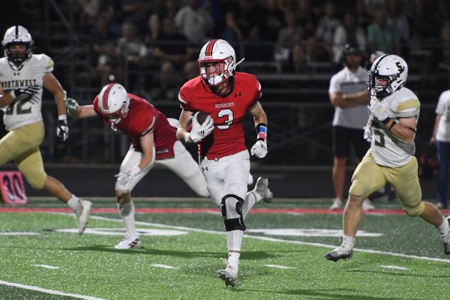 Koby Nachtigal heads for the end zone on a 69-yard half-back pass from Carlos Collazo, putting the finishing touches on Aurora’s 43-13 win over Northwest.