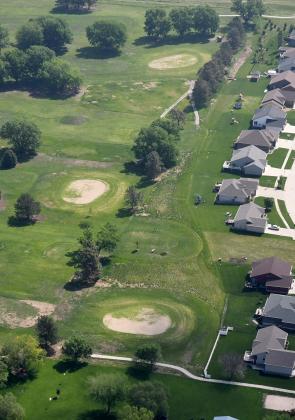 This aerial photo shows the impact of drought conditions at Poco Creek Golf Course, where a renovation project began this week to repair the greens.