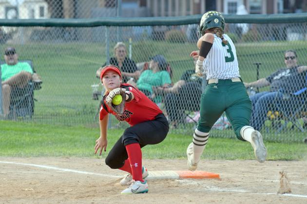 Aurora first baseman Kennedy Kleinschmidt reaches out just in time for the out during a 2-0 loss to Central City Thursday. 