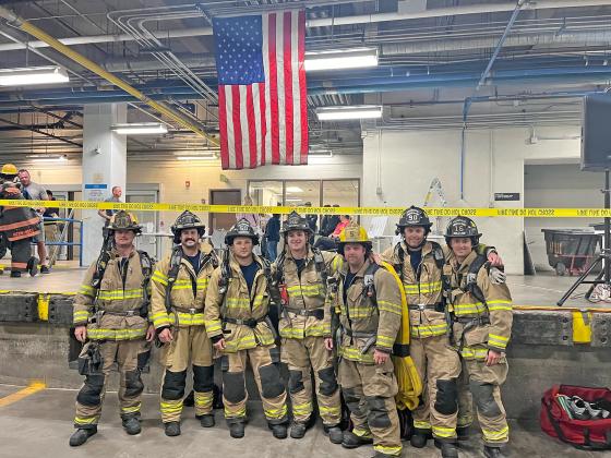Aurora Volunteer Fire and Rescue members Tanner Greenough (third from right) and Chris Hyde (far right) were among 343 firefighters who participated in the 9/11 Memorial Stair Climb. They participated in a team with Grand Island Fire.