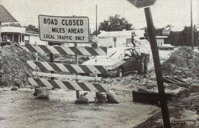 This photo taken by long-time News-Register employee Laurie Pfeifer shows Skeet Mahler’s vehicle stuck in the mud of the construction area at the 9th Street intersection of Highway 34. Originally published on June 20, 1990, similar stories were told alongside the photo of the project being plagued by rain.
