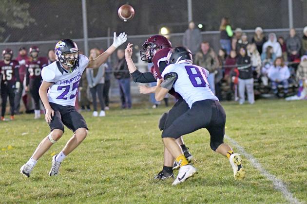 Kash Majerus (81) comes up with a strip sack that Wyatt Dose (25) picked up and took to the house in Hampton’s 64-32 win over St. Edward Friday. 