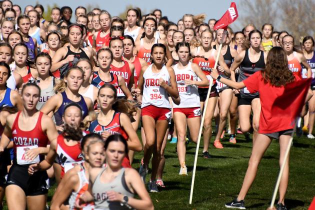It looked like a sea of humanity rolling down the fairway in the opening stretch of the C1 girls state cross country meet Friday. Pictured at center are Aurora freshmen Alexis Ericksen and Ella Eggleston. At far right are Kaitlyn Oswald, Laighla Rice and Ella Curtis.