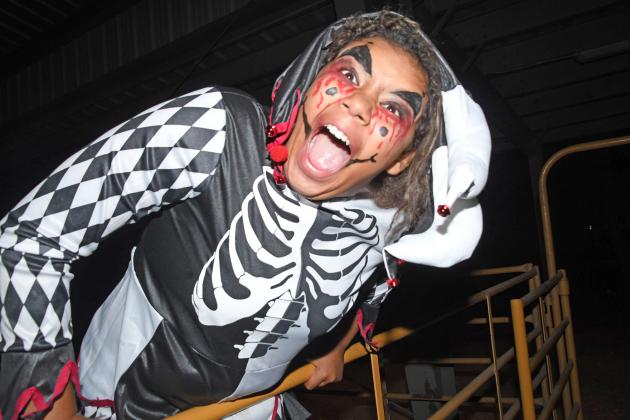Skeletal jester Ayanna Miller jumps out to give a scare at Haunted Fairgrounds. The event was a boo-st of Halloween spirit attracting 842 people to get a fright last weekend and raising $977 for the Hamilton County Food Pantry.