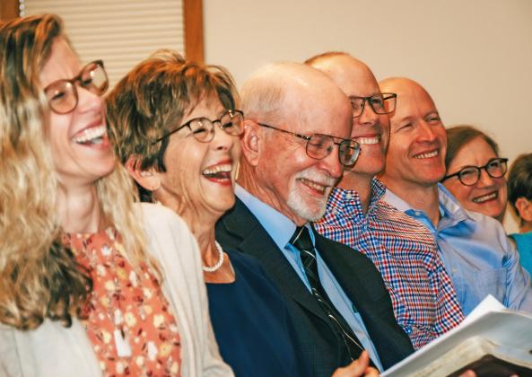 Kathy and Paul Nauman laugh at memories with the congregation at the 45 year celebration of their service at Stockham Community Church. Starting with a size of around 30, the Naumans have grown the church membership to about 300 through their decades of service.