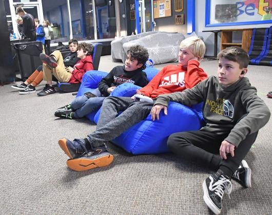 Three boys, Christian Jividan, Milo Gustafson and Ryder Retzlaff play an Xbox video game at the Hamilton County Youth Center. Paul Johnson claimed $40,000 in renovation to modernize the Youth Center with $50,000 raised for those costs and continued operations since reopening in June.