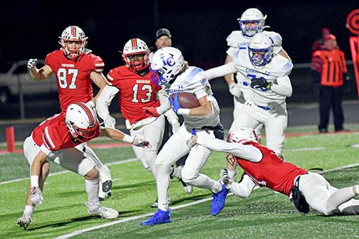 Aurora’s defense held Lincoln Christian well below its season rushing totals as well as zero passing yards as the Huskies picked up a 48-28 win in the Class C1 quarterfinals Friday night. 