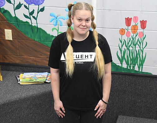 Valeriia Vinokarova poses in the reading corner of the Giltner Public School library. Vinokarova has wanted to attend American high school since she was 6 years old, watching Disney movies. So far she says the experience has lived up to her expectations.