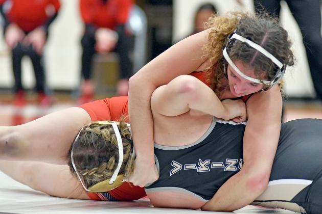 Angelina Leininger looks for an early pinfall victory during her match in the Northwest dual Dec. 20. 