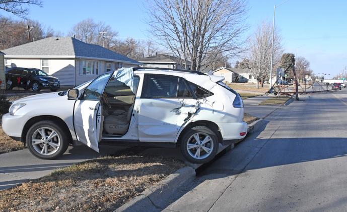This vehicle hit a pivot and went over the curb, causing damage to the left rear door panels. Police Chief Paul Graham stated that the driver caused the accident while pulling out underneath the pivot.
