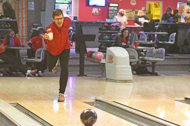 Aurora Unified Bowling team member Nicolas Schleichardt puts spin on his bowling ball at the B-4 district competition in York. The team has improved this season, according to coach Ella Aksamit, placing third twice and second once this season.