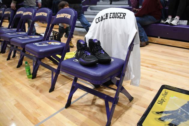 A single, empty seat at the head of Hampton’s bench was the focus of the night Feb. 11 as a gymnasium full of family and friends paid tribute to Coach Kyle Ediger, who was killed in a car/train accident earlier that week.