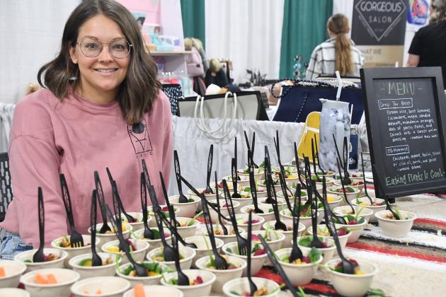 Brittany Lozdoski of EPIC (Eating Plants is Cool) shows samples of her salads at her booth at the Live Healthy Health Fair Saturday. Lozdoski and other vendors expressed eagerness to network with other health-minded people in Hamilton County. 