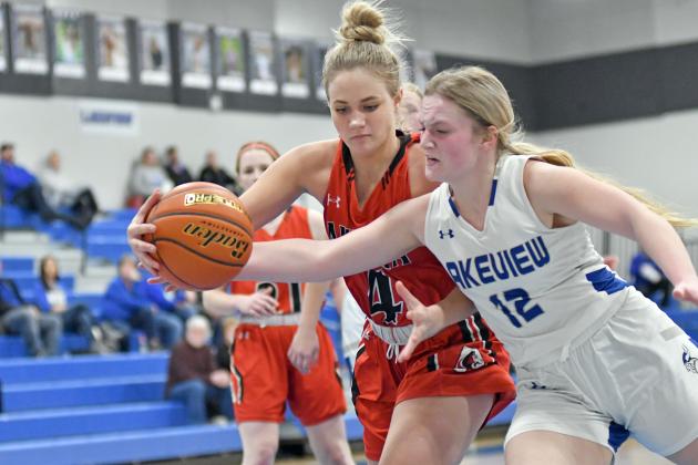 Denae Nachtigal fights for and saves an offensive possession for Aurora in the second half of a close 34-31 loss at Lakeview Jan. 24. Nachtigal tallied eight points, five rebounds and four steals in the game. 