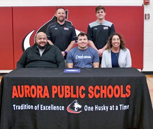 Aurora’s Carlos Collazo signed with Concordia University Feb. 8 to play college football alongside his parents, Eric and Nikki as well as Aurora football coaches Kyle Peterson and Cole Ashby. 