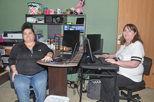 Mindy Jemison (left) and Chris Florez, co-owners of Homegrown Tax Pros & Bookkeeping in Giltner, sit at their home office. The two handle individual and business taxes along with other financial services.